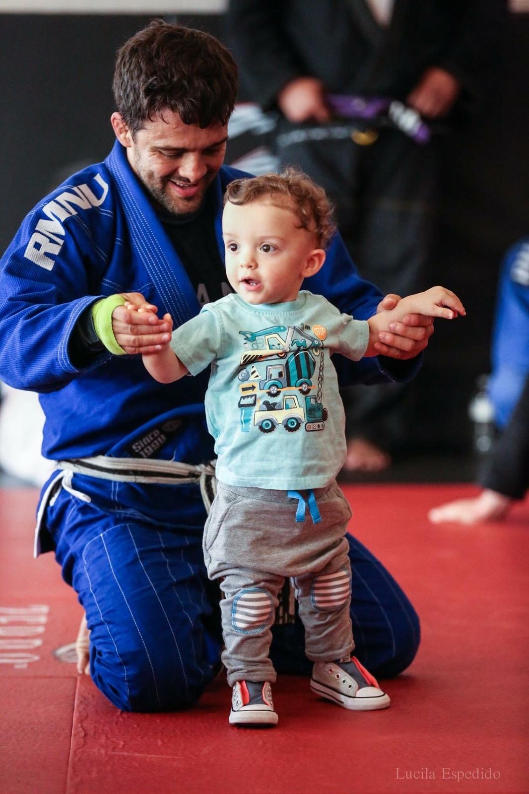 A coach training with a toddler